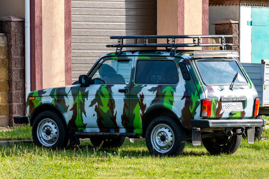 SUV painted under camouflage. Bashkortostan, Russia - 12 June, 2021.