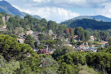 Fototapeta na wymiar view of nature and buildings among the mountains of Monte Verde, district of Camanducaia, interior of Minas Gerais