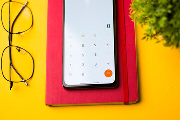 Phone calculator with notebooks stock image.
