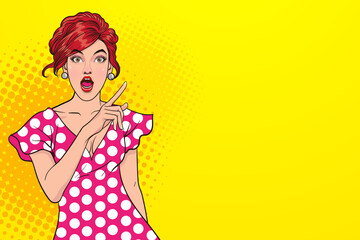 Surprised sexy woman with open mouth and pointing finger up