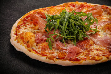 Pizza with parma and rucola