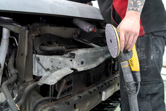 Crop man buffing car in service