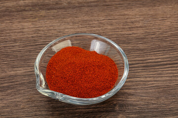 Dry paprika powder in the bowl