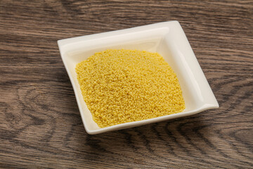 Raw cous cous heap in the bowl