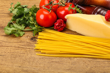 Raw Italian spaghetti heap with cheese