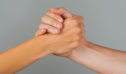 Helping hand. Gesture, sign of help and hope. Two hands taking each other. People handshake.