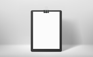 White binder with white paper sheet and paperclip