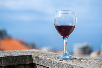a glass of cold red wine on the balcony against