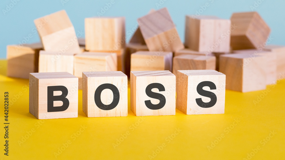 Poster boss word construction with letter blocks and a shallow depth of field