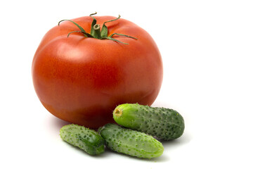 Fresh gherkins and big red tomato isolated on white background.