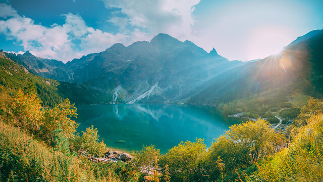 Fototapeta Tatra National Park, Poland. Famous Mountains Lake Morskie Oko Or Sea Eye Lake In Summer Evening. Beautiful Sunset Sun Sunshine Sunrays Above Tatras Lake Landscape