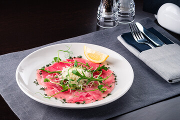 Tuna carpaccio on a plate
