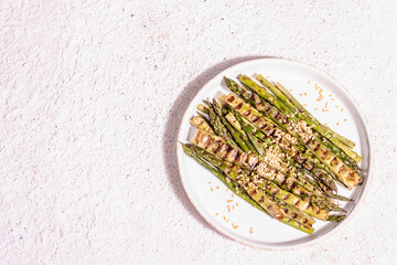 Ripe grilled asparagus. Golden flax seeds, healthy and wholesome food concept