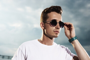 Fashion young man in sunglasses