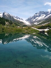 Naklejka na ściany i meble alpine lake in the mountains Switzerland Lötschental Schweiz Suisse lac alpin 