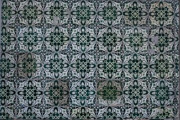 Traditional old tiles wall on the street painted tin-glazed, azulejos ceramic tilework. Porto, Portugal.