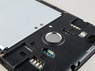 Fingerprint sensor in a disassembled smartphone, fingerprint scanner, personal data protection, digital security