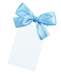 blank white gift tag with light blue bow on isolated white background