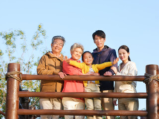 Happy family of five in the outdoor group photo