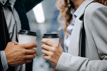 coffee cups in the hands of a couple in love.