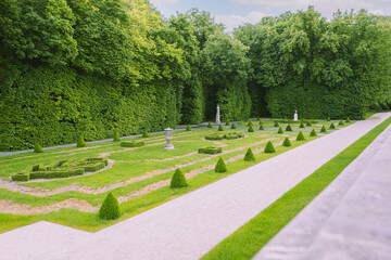 A beautiful landscape of a city park with paths, flower beds and trees