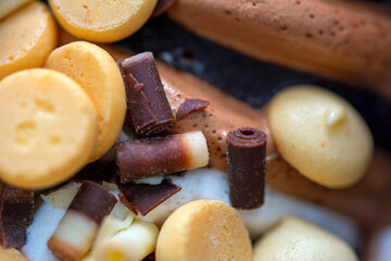 Macro close up on a profiterol ice cream with vanilla and chocolate 