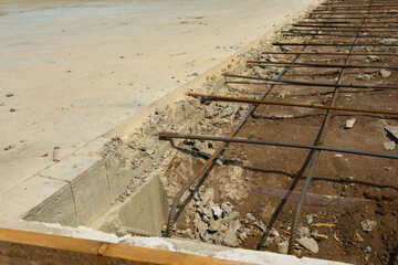 Reinforcement rod and wood forms ready for concrete pour for second half of slab of new commercial...