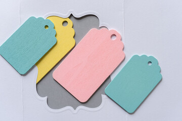 set of colorful tags on a fancy paper frame