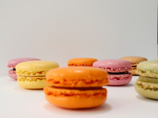 colorful macaroons on wooden table