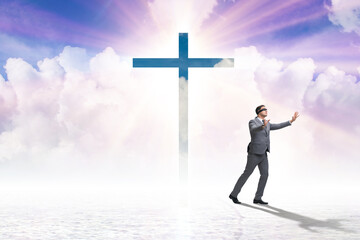 Religious concept with cross and lonely man