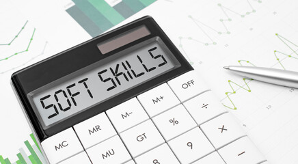 calculator with the word Soft Skills on display with chart