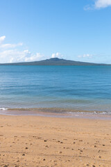 Fototapeta na wymiar Rangitoto Island on distant horizon vertical.