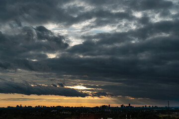 Toronto Canada scenic view of cityscape skyline at hot scorch summer evening sunset. Orange dusk sun lights and clouds. Climate change concept. Dramatic cloudscape.