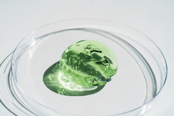 Green gel texture of a cosmetic care product.
