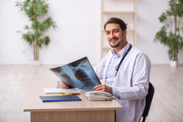 Young male doctor radiologist working in the clinic