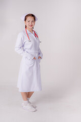 Young nurse woman smile face with stethoscope with nature white background,
