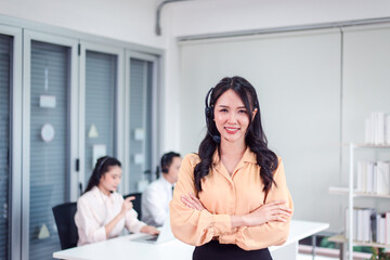 Portrait of call center asian woman operator working with headset at office,Beautiful asian...