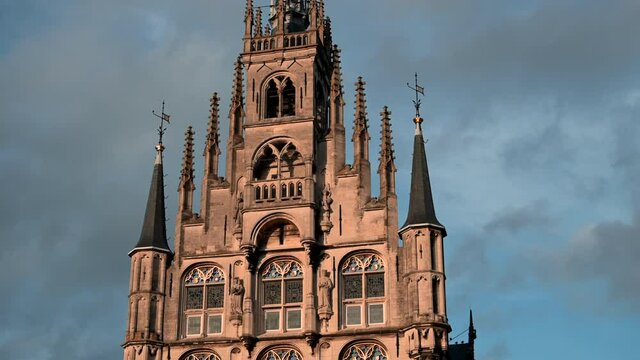Close view of the facade of the gothic town hall in the city of Gouda, Netherlands.