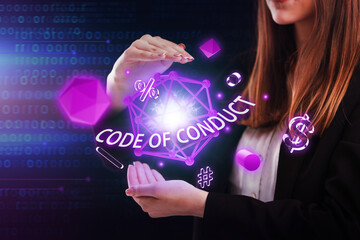 Business, Technology, Internet and network concept. Young businessman working on a virtual screen of the future and sees the inscription: Code of conduct