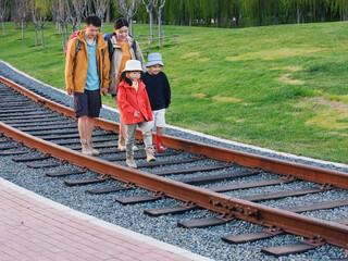 Naklejka premium A Happy family of four outdoor hiking