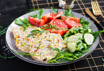 Trendy salad. Chicken meatloaf with salad fresh tomatoes and cucumber. Healthy food, ketogenic diet, diet lunch concept. Keto, Paleo diet menu.
