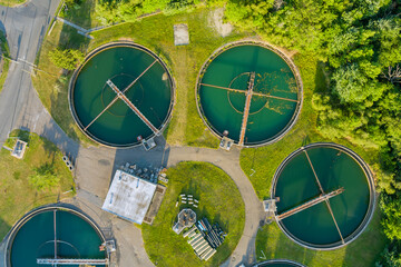 Aerial top down view on sewage treatment facilities aeration water purification tanks for modern...