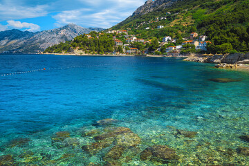 Fototapeta na wymiar Transparent clean sea and fantastic beach in Brela, Dalmatia, Croatia