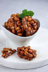 Gula kacang or Ampyang is one of Indonesia's traditional snack derived from peanuts and palm sugar.