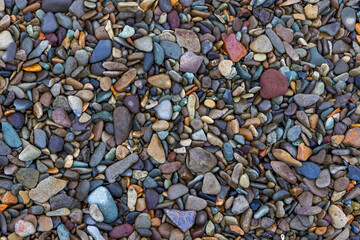 Top down view of colorful smooth beach stones