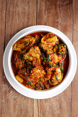 Ayam Rica-Rica. Traditional dish from Manado, Indonesia, braised chicken in spicy paste and garnish with lemon basil.