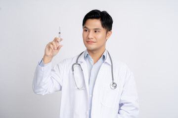 Portrait of an Asian male doctor holding a syringe with an injection.