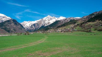 Fototapeta na wymiar View of Mount Tetnuldi from Tsaldashi village, Svaneti, Georgia