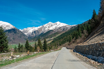 Fototapeta na wymiar Mount Tetnuldi rises above the Great Caucasian Range in the upper Svaneti