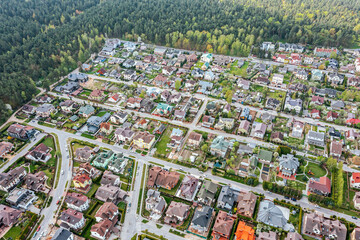 aerial view of residential houses neighborhood in suburban district at summer day